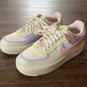 New none worn Nike Air Forces with neon colors.